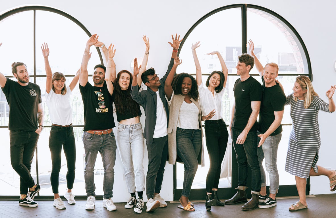 Group of diverse young professionals by a window